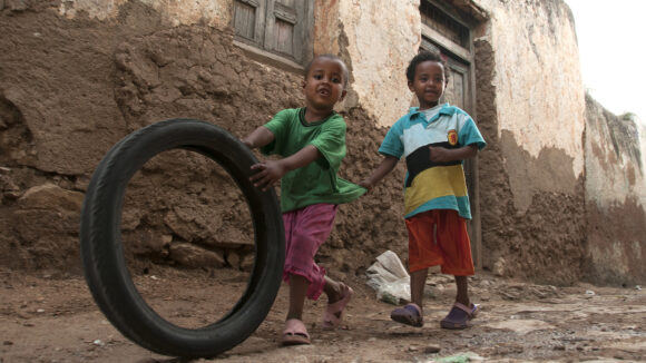 Ethiopian kids playing with a tyre.