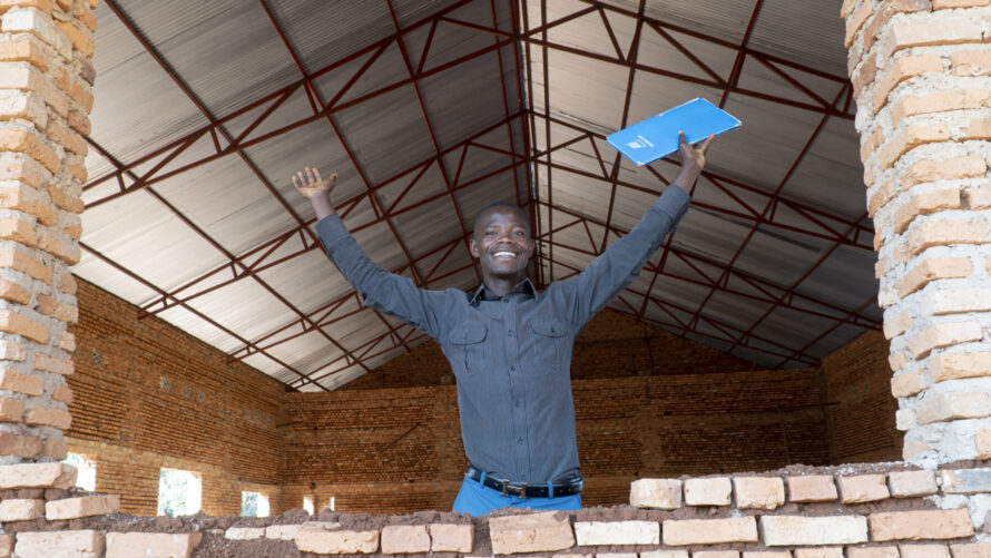 Man standing front of Gashikanwa Youth Center in Ngozi, Burundi.